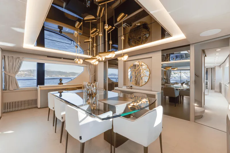 Serendipity Yacht Photos Pics Luxurious dining area on 2008 Azimut 116 yacht with elegant decor and sea views.