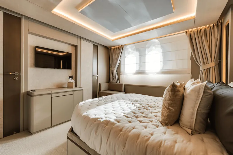 Serendipity Yacht Photos Pics Luxurious bedroom interior of 2008 Azimut 116 yacht with modern decor and ambient lighting.