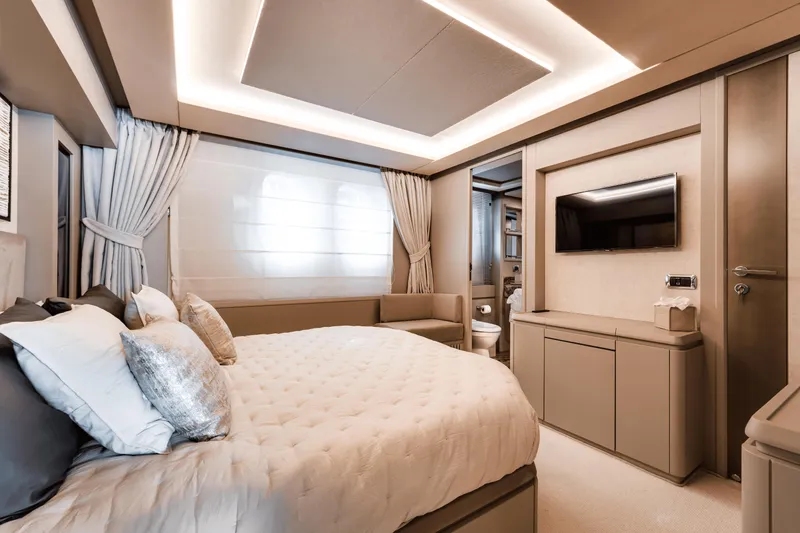 Serendipity Yacht Photos Pics Luxurious bedroom interior of 2008 Azimut 116 yacht with modern decor and ambient lighting.