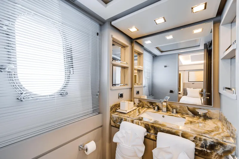 Serendipity Yacht Photos Pics Luxurious bathroom interior of 2008 Azimut 116 yacht with marble countertop and modern fixtures.