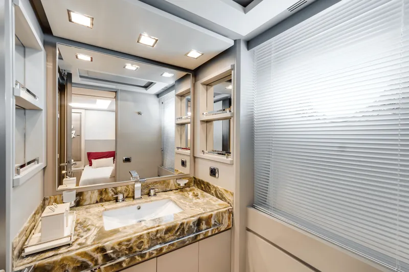 Serendipity Yacht Photos Pics Luxurious bathroom interior of 2008 Azimut 116 yacht with marble countertop and modern fixtures.