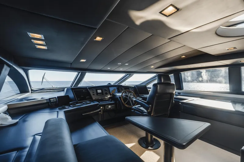 Serendipity Yacht Photos Pics Luxurious interior of 2008 Azimut 116 yacht with modern helm and seating.