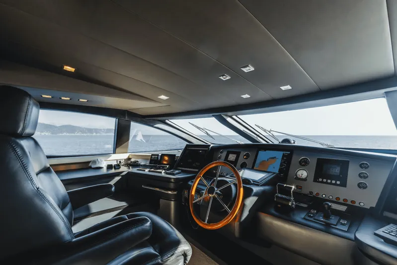 Serendipity Yacht Photos Pics Luxurious 2008 Azimut 116 yacht cockpit with modern navigation equipment and leather seating.