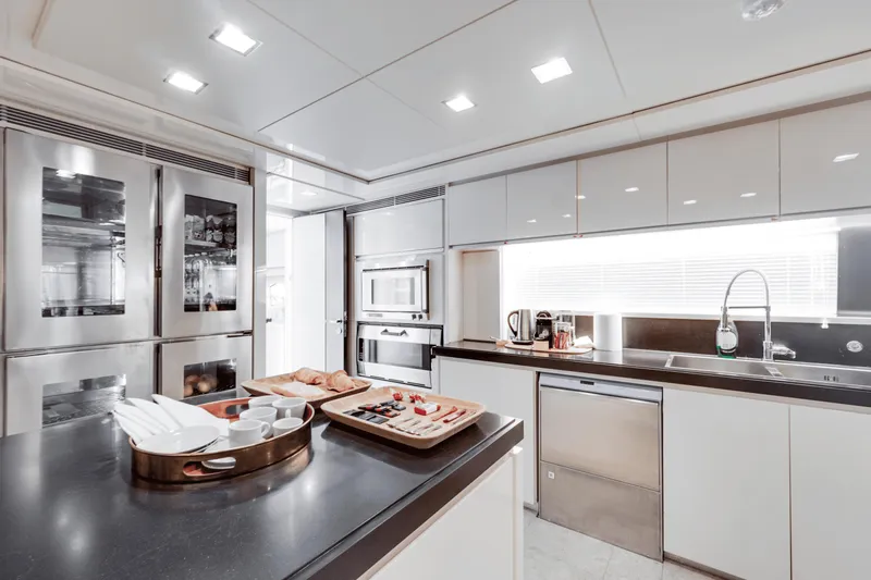 Serendipity Yacht Photos Pics Luxurious kitchen interior on 2008 Azimut 116 yacht, featuring modern appliances and sleek design.