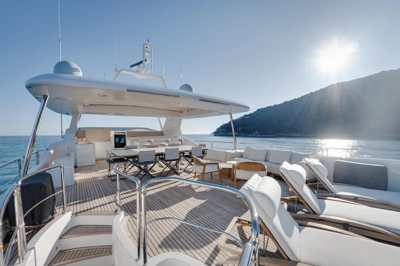 Serendipity Yacht Photos Pics Luxurious 2008 Azimut 116 yacht deck with sun loungers and ocean view.