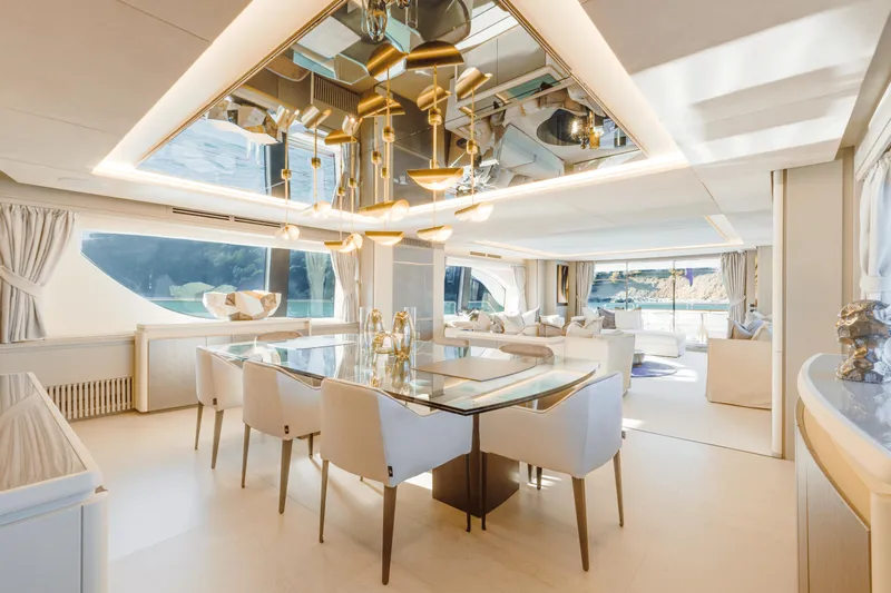 Serendipity Yacht Photos Pics Luxurious interior of 2008 Azimut 116 yacht with elegant dining area and modern decor.