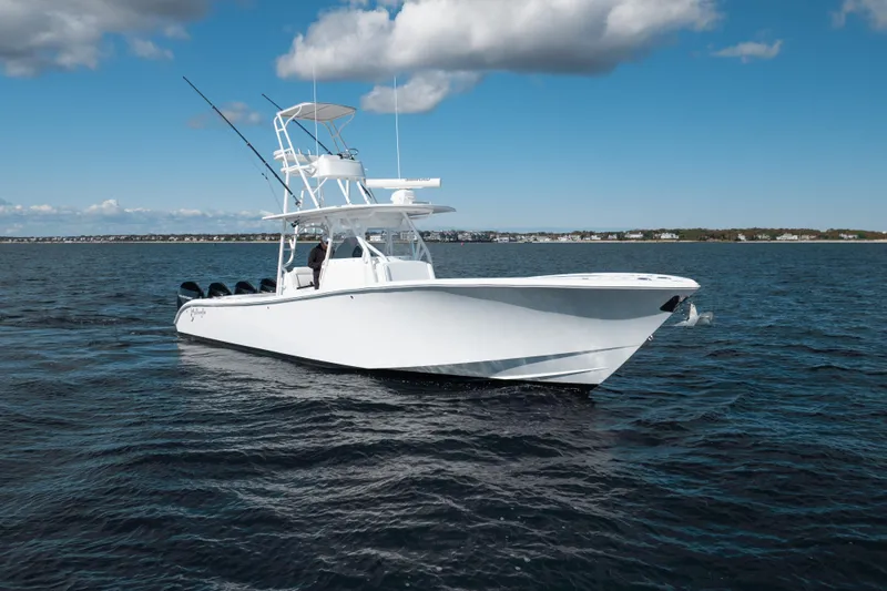 Afishinsea Yacht Photos Pics 2014 Yellowfin 39 Offshore boat on open water under blue sky.