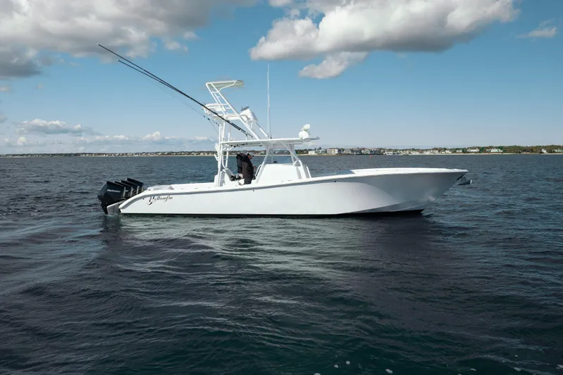 Afishinsea Yacht Photos Pics 2014 Yellowfin 39 Offshore boat on open water under a partly cloudy sky.