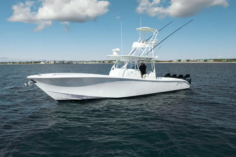 Afishinsea Yacht Photos Pics 2014 Yellowfin 39 Offshore boat on open water under a partly cloudy sky.