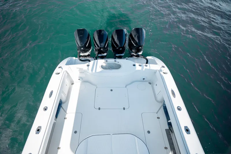 Afishinsea Yacht Photos Pics 2014 Yellowfin 39 Offshore boat with four powerful outboard engines on turquoise water.