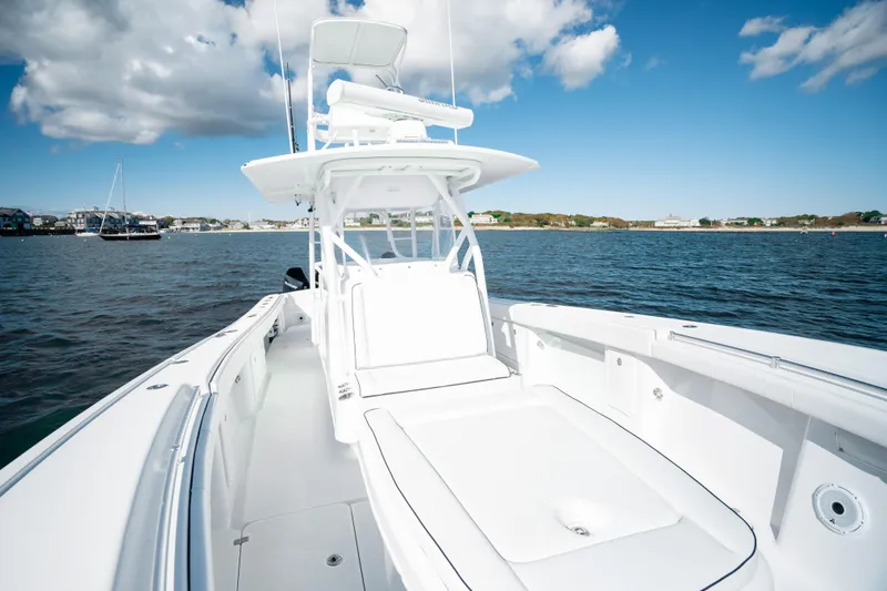 Afishinsea Yacht Photos Pics 2014 Yellowfin 39 Offshore boat on calm water under blue sky.
