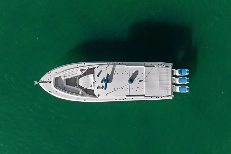 No Name Yacht Photos Pics Aerial view of 2023 HCB 42 Lujo boat on clear green water.