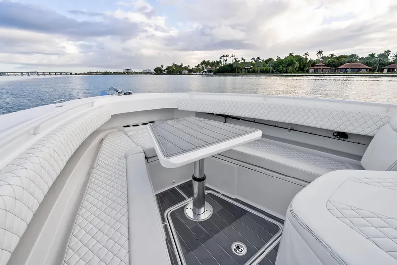 No Name Yacht Photos Pics Luxurious seating area on 2023 HCB 42 Lujo boat with scenic waterfront view.