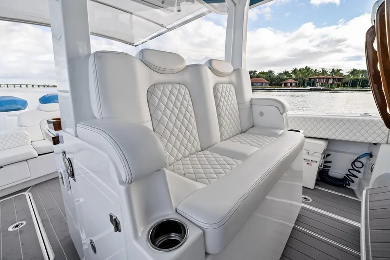 No Name Yacht Photos Pics Luxurious seating on 2023 HCB 42 Lujo boat with quilted white upholstery.