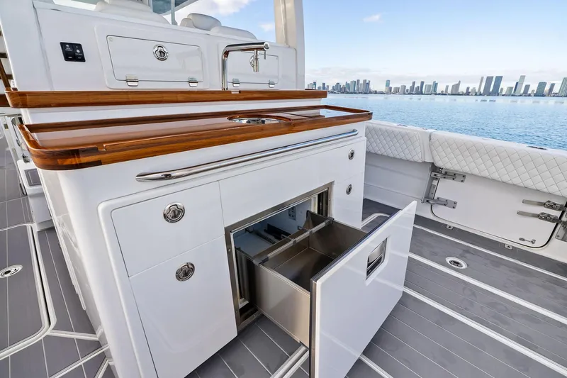 No Name Yacht Photos Pics Luxury HCB 42 Lujo yacht interior with sleek cabinetry and ocean view, 2023 model.