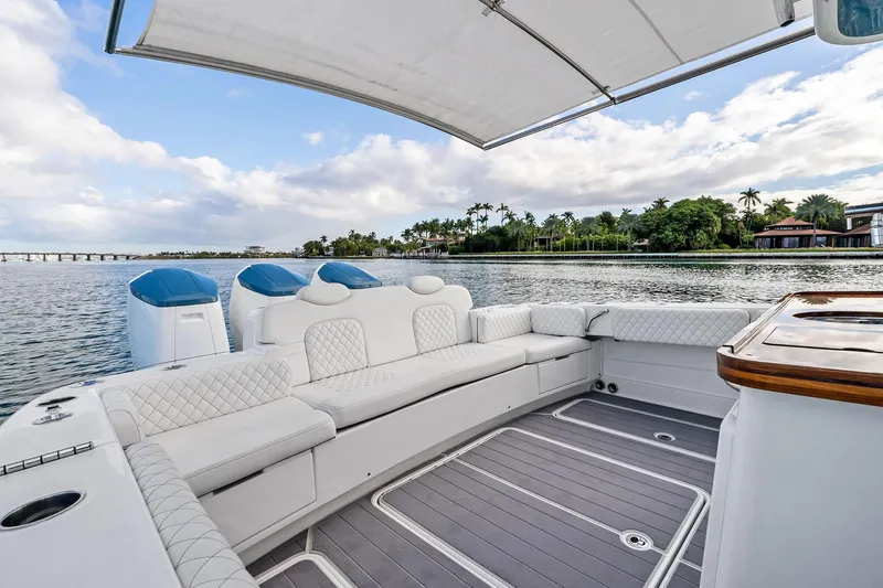 No Name Yacht Photos Pics Luxurious 2023 HCB 42 Lujo boat interior with plush seating and scenic waterfront view.