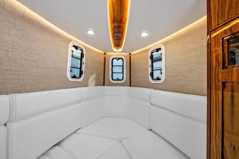 No Name Yacht Photos Pics Luxurious interior of 2023 HCB 42 Lujo boat with elegant seating and ambient lighting.