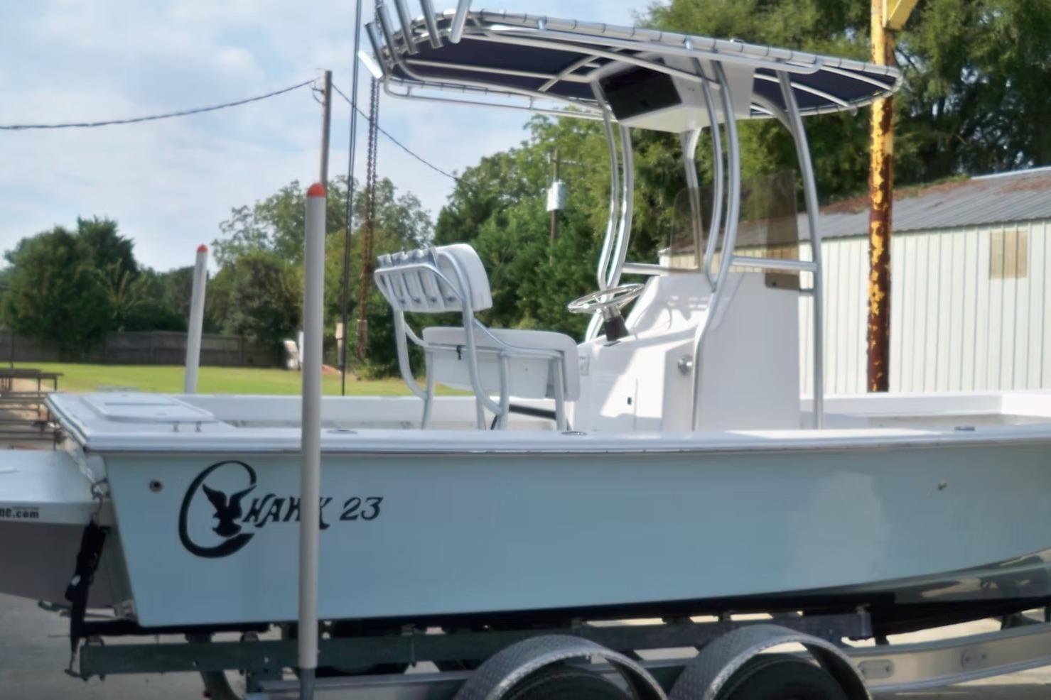 2026 C-Hawk 23 Center Console boat on trailer, featuring sleek design and spacious deck.