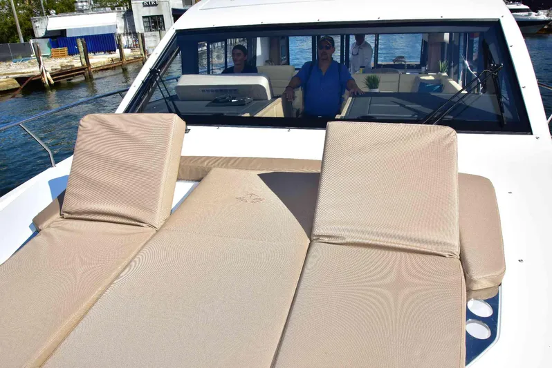  Yacht Photos Pics 2022 Sealine C430 yacht with sun loungers on deck, docked at marina.