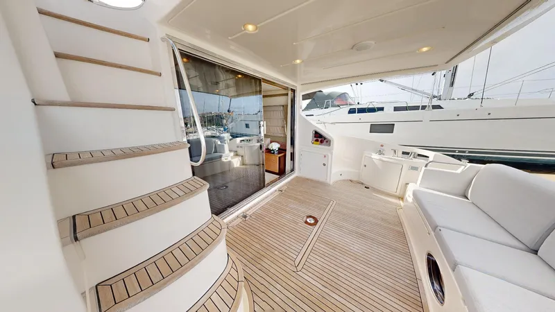  Yacht Photos Pics Azimut 58 yacht interior, 2011 model, featuring elegant wooden flooring and comfortable seating.