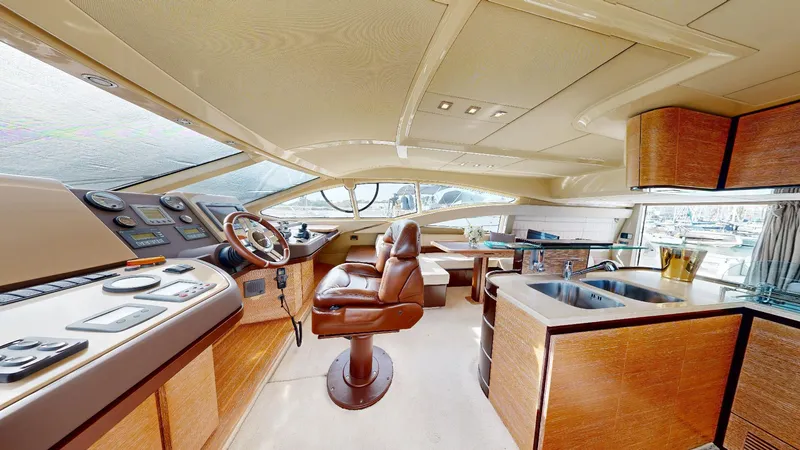  Yacht Photos Pics Luxurious interior of a 2011 Azimut 58 yacht with modern helm and seating area.