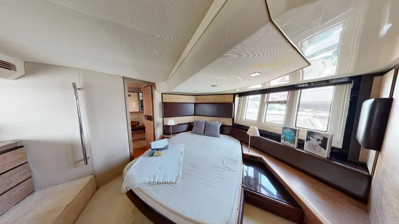  Yacht Photos Pics Luxurious bedroom interior of a 2011 Azimut 58 yacht with modern design elements.
