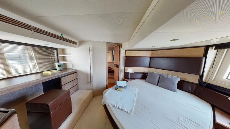  Yacht Photos Pics Luxurious bedroom interior of 2011 Azimut 58 yacht with modern furnishings and large bed.