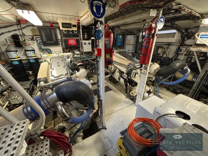  Yacht Photos Pics Engine room of a 1987 Hatteras 85 yacht, featuring machinery and equipment.