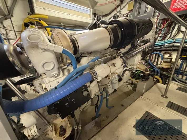  Yacht Photos Pics Engine room of 1987 Hatteras 85 yacht with visible machinery and cables.