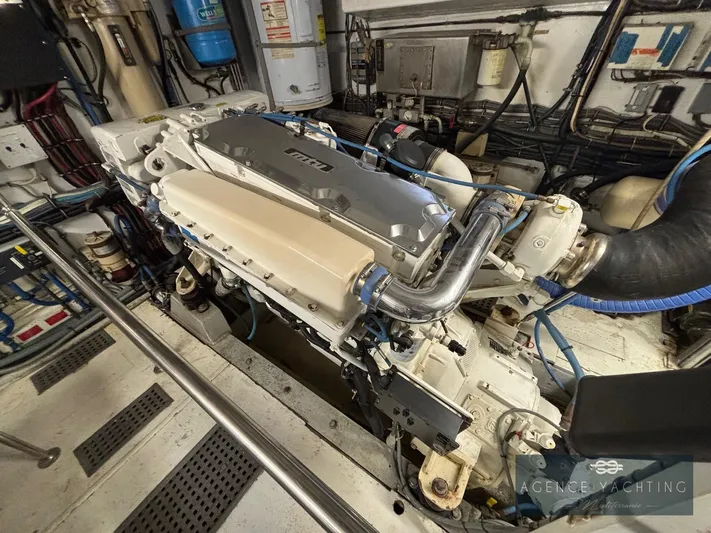  Yacht Photos Pics Engine room of a 1987 Hatteras 85 yacht, showcasing detailed machinery and components.