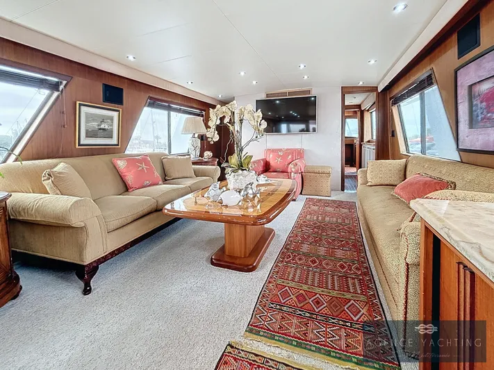  Yacht Photos Pics Luxurious interior of a 1987 Hatteras 85 yacht with elegant furnishings and decor.