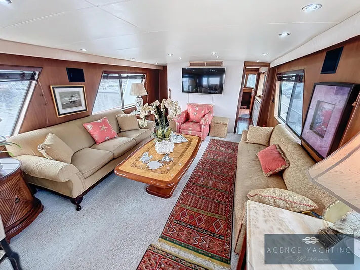  Yacht Photos Pics Luxurious interior of 1987 Hatteras 85 yacht with elegant seating and decor.