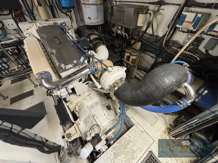  Yacht Photos Pics Engine room of 1987 Hatteras 85 yacht with visible machinery and piping.