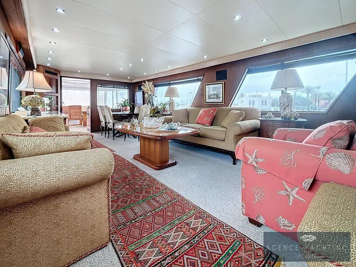  Yacht Photos Pics Luxurious interior of a 1987 Hatteras 85 yacht with elegant seating and decor.