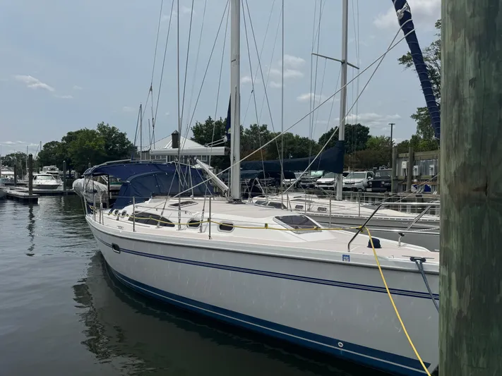 Sea-ductive Yacht Photos Pics 2011 Catalina 375 sailboat docked at a marina, featuring a sleek white hull.