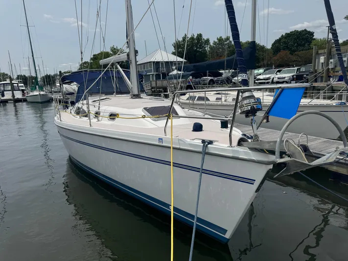Sea-ductive Yacht Photos Pics 2011 Catalina 375 sailboat docked at marina, featuring sleek design and white hull.