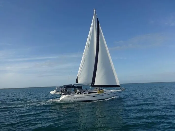 Sea-ductive Yacht Photos Pics Sailing yacht Catalina 375, 2011 model, gliding on open sea under clear blue sky.