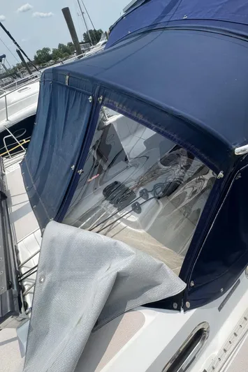 Sea-ductive Yacht Photos Pics 2011 Catalina 375 sailboat with blue canvas cover and clear window at marina.