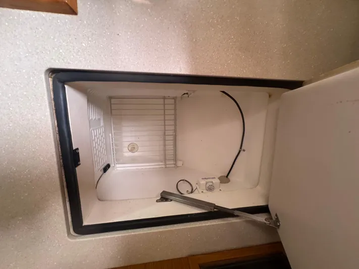 Sea-ductive Yacht Photos Pics Open refrigerator compartment in 2011 Catalina 375 yacht interior.