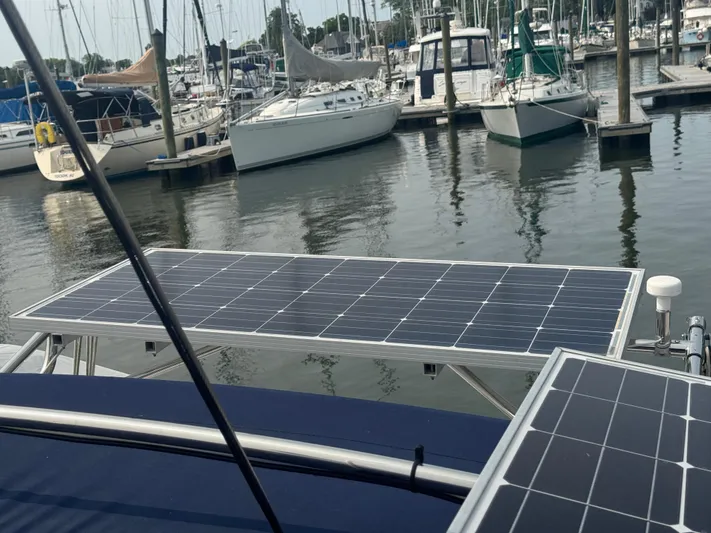 Sea-ductive Yacht Photos Pics Solar panels on a 2011 Catalina 375 sailboat docked at a marina.
