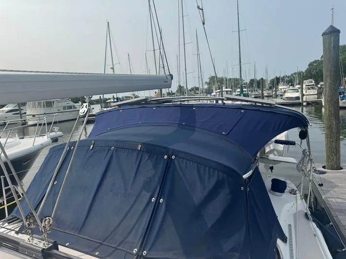 Sea-ductive Yacht Photos Pics Catalina 375 sailboat, 2011 model, docked at a marina with blue canvas cover.