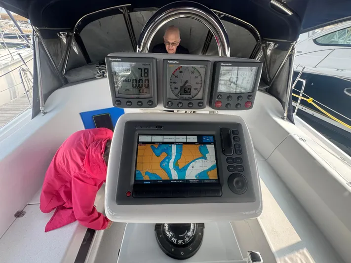 Sea-ductive Yacht Photos Pics Cockpit of 2011 Catalina 375 sailboat with navigation instruments and chart display.