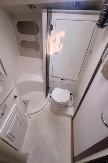 Sea-ductive Yacht Photos Pics 2011 Catalina 375 yacht bathroom with compact toilet and storage cabinets.