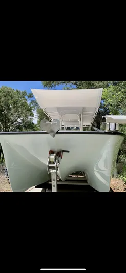  Yacht Photos Pics 2020 Calcutta 263 Center Console boat with T-top, front view, outdoors.