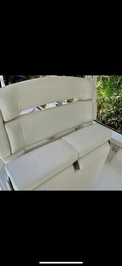  Yacht Photos Pics 2020 Calcutta 263 Center Console boat seat, white upholstery, outdoor setting.