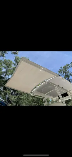  Yacht Photos Pics Calcutta 263 Center Console boat canopy against a clear blue sky, 2020 model.