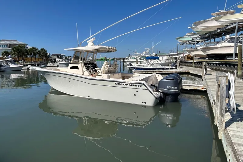  Yacht Photos Pics 2020 Grady-White Canyon 306 boat docked with Yamaha engines, clear sky background.