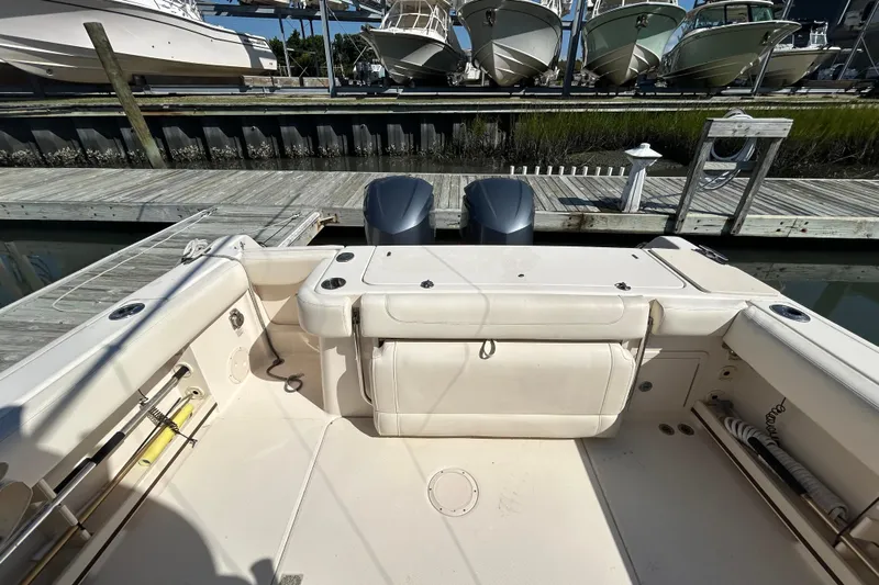  Yacht Photos Pics 2020 Grady-White Canyon 306 boat interior at dock, featuring dual engines and spacious seating.