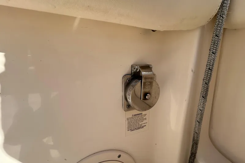  Yacht Photos Pics Grady-White Canyon 306 boat detail, 2020 model, featuring a metal fixture and warning label.