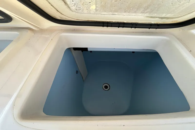  Yacht Photos Pics Livewell compartment of 2020 Grady-White Canyon 306 boat, open and empty.